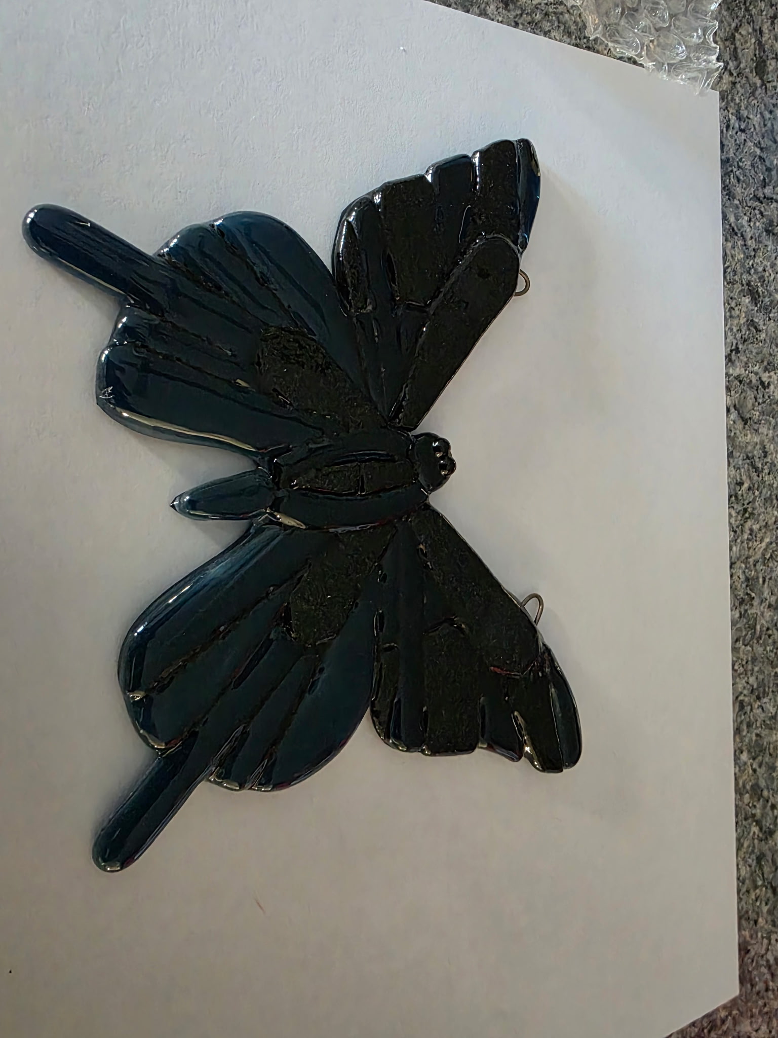 Black fused glass dragonfly suncatcher with mottled textured wings